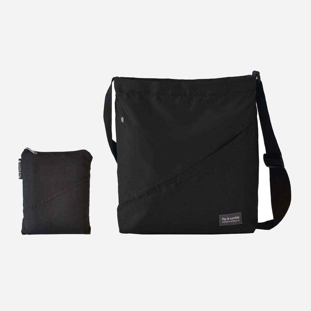 black cross body bag - flip & tumble - stylish packable travel bag, folding travel bag