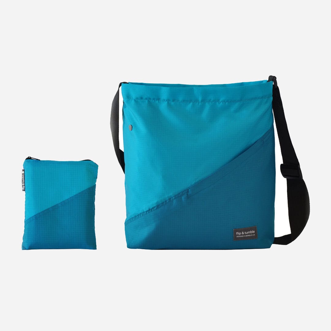 blue cross body bag - flip & tumble - stylish packable travel bag, folding travel bag