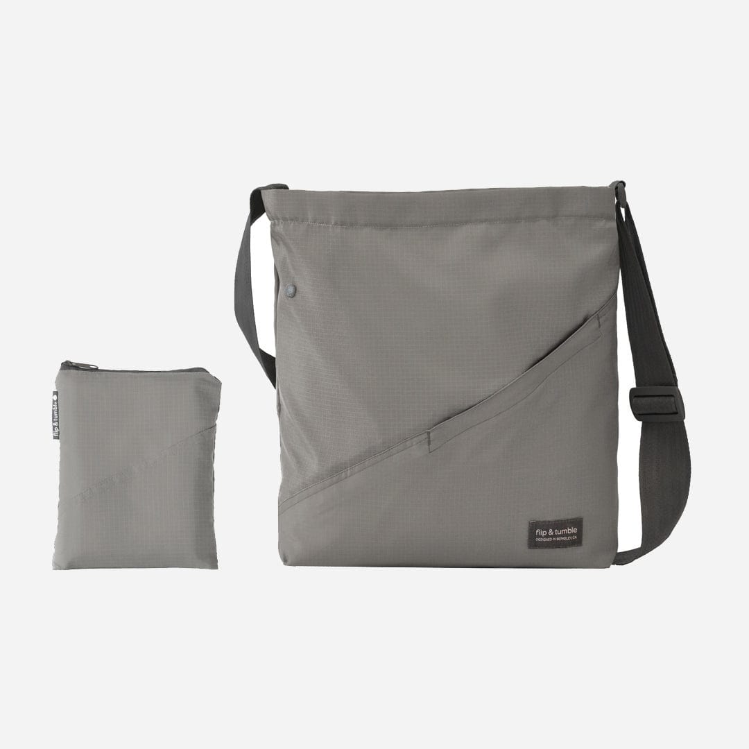 grey cross body bag - flip & tumble - stylish packable travel bag, folding travel bag