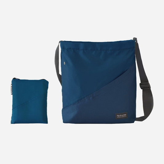 navy cross body bag - flip & tumble - stylish packable travel bag, folding travel bag
